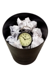 Clock in waste paper basket